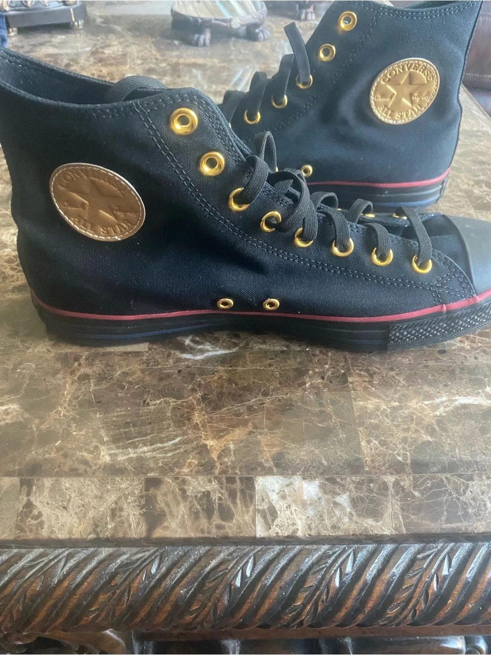 Converse mens Black High-Top Sneakers with Gold Accents and Red Stripe